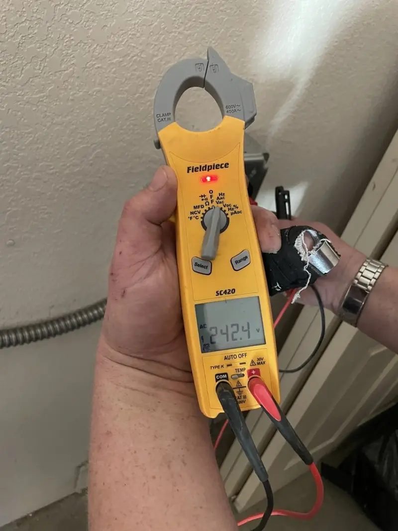 Voltage testing with clamp meter during Whole House Surge Protector in Ashburn